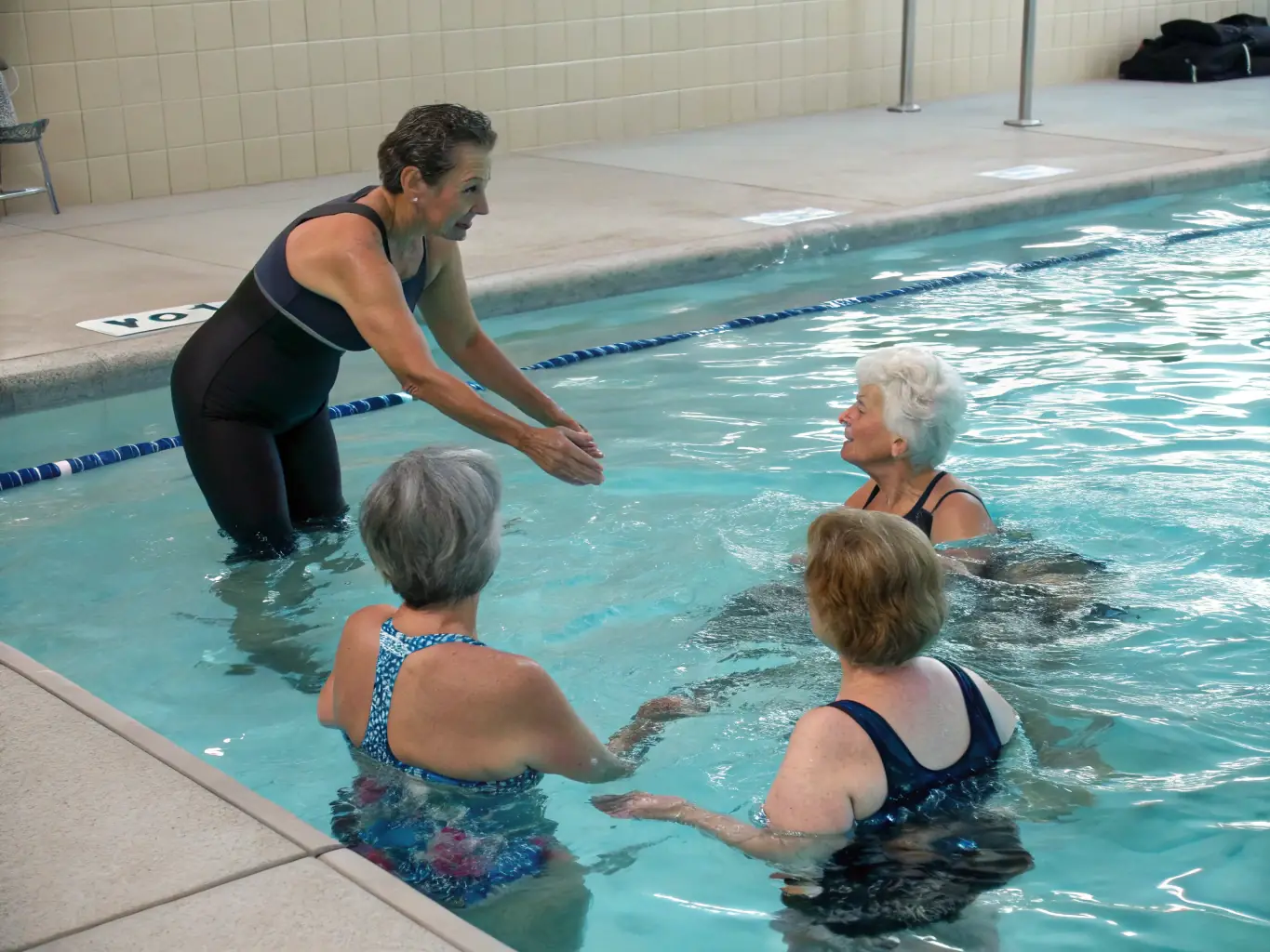 An image of a group of seniors participating in a water aerobics class, showcasing the benefits of low-impact exercise.